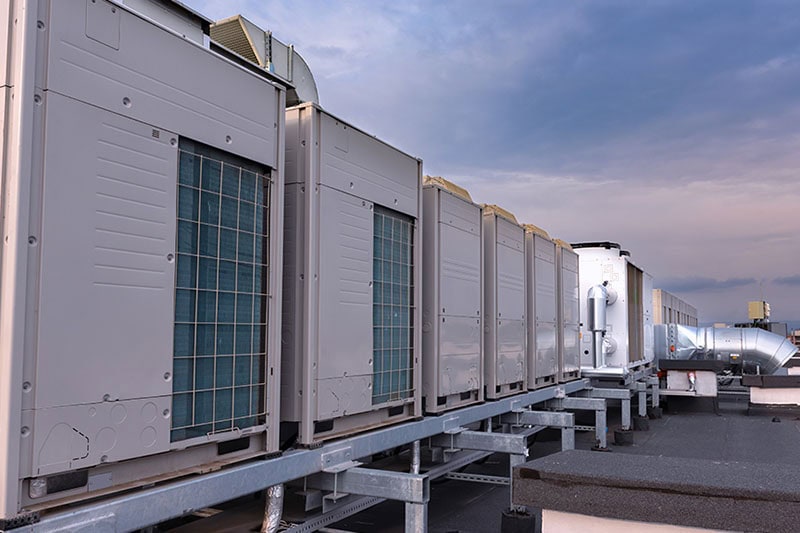 7 Ways to Prepare Your Commercial HVAC System for Winter. Units on a rooftop.